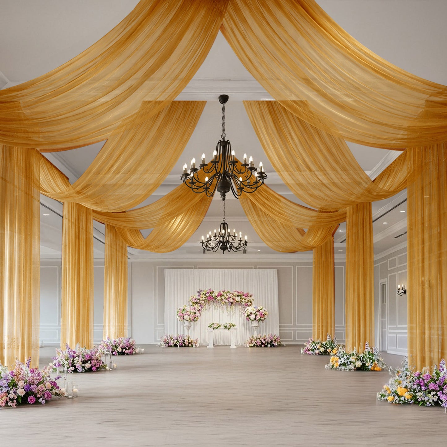 Gold sheer backdrop drape for wedding arch and ceiling decor.