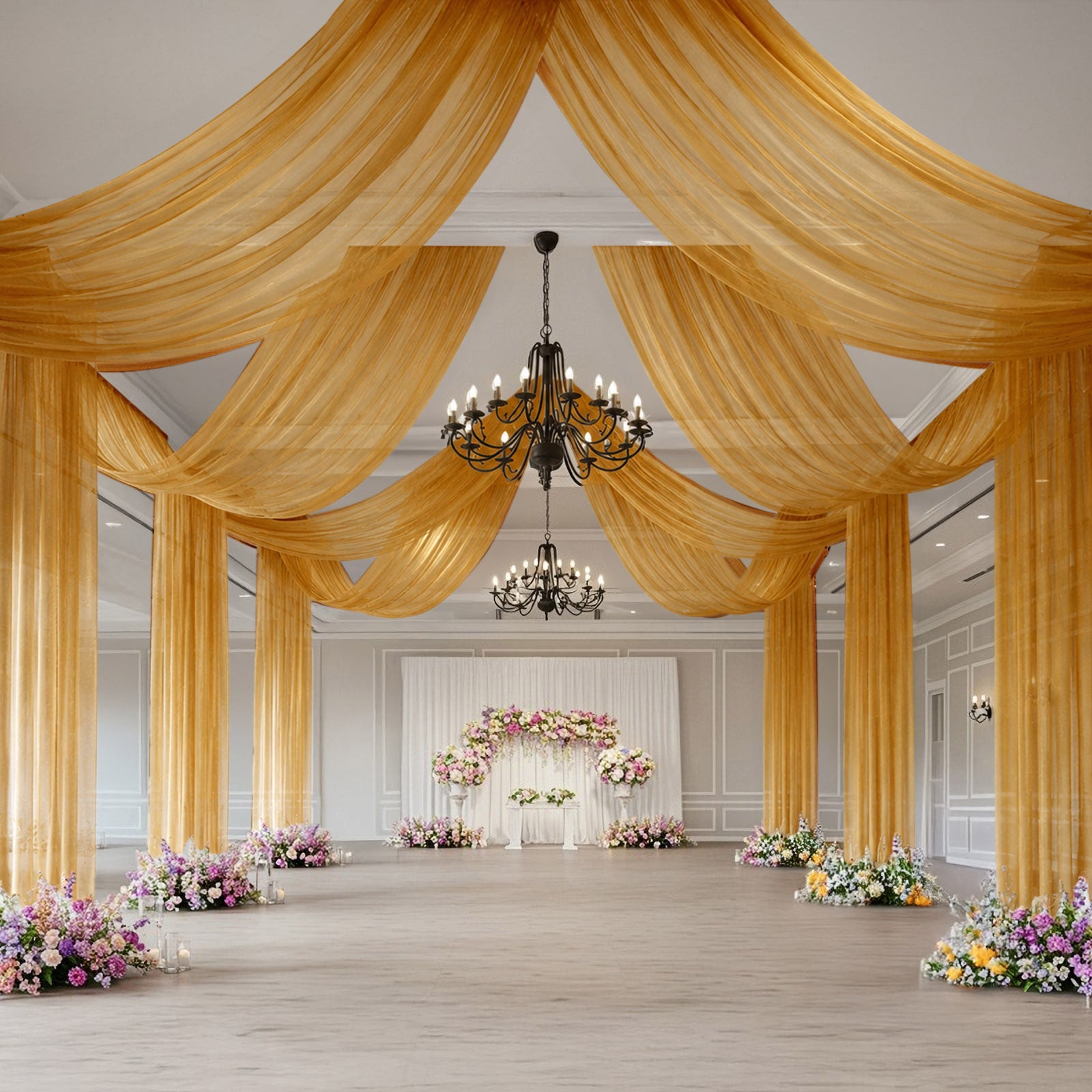 Gold sheer backdrop drape for wedding arch and ceiling decor.
