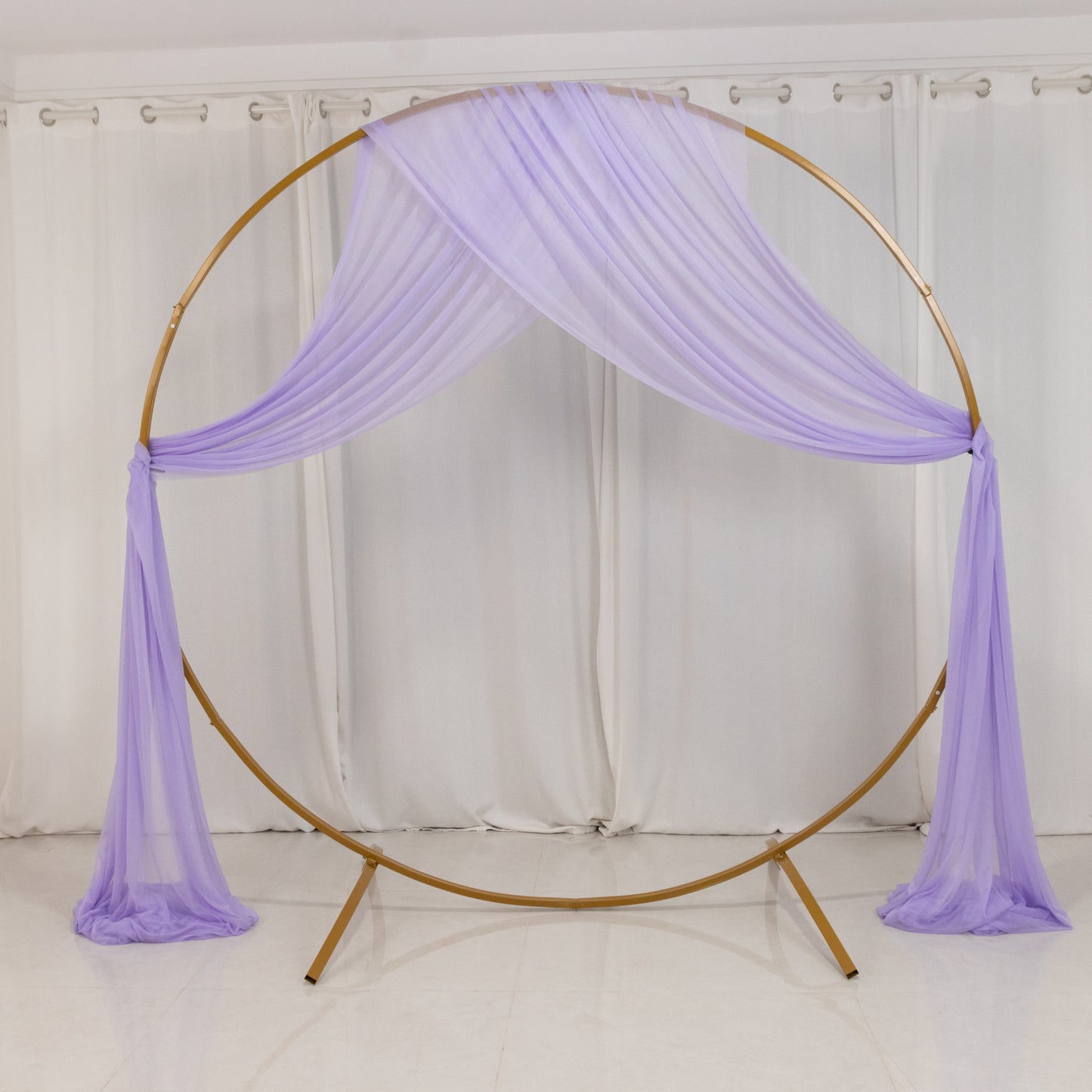 Lavender sheer backdrop drape for wedding arch decor.