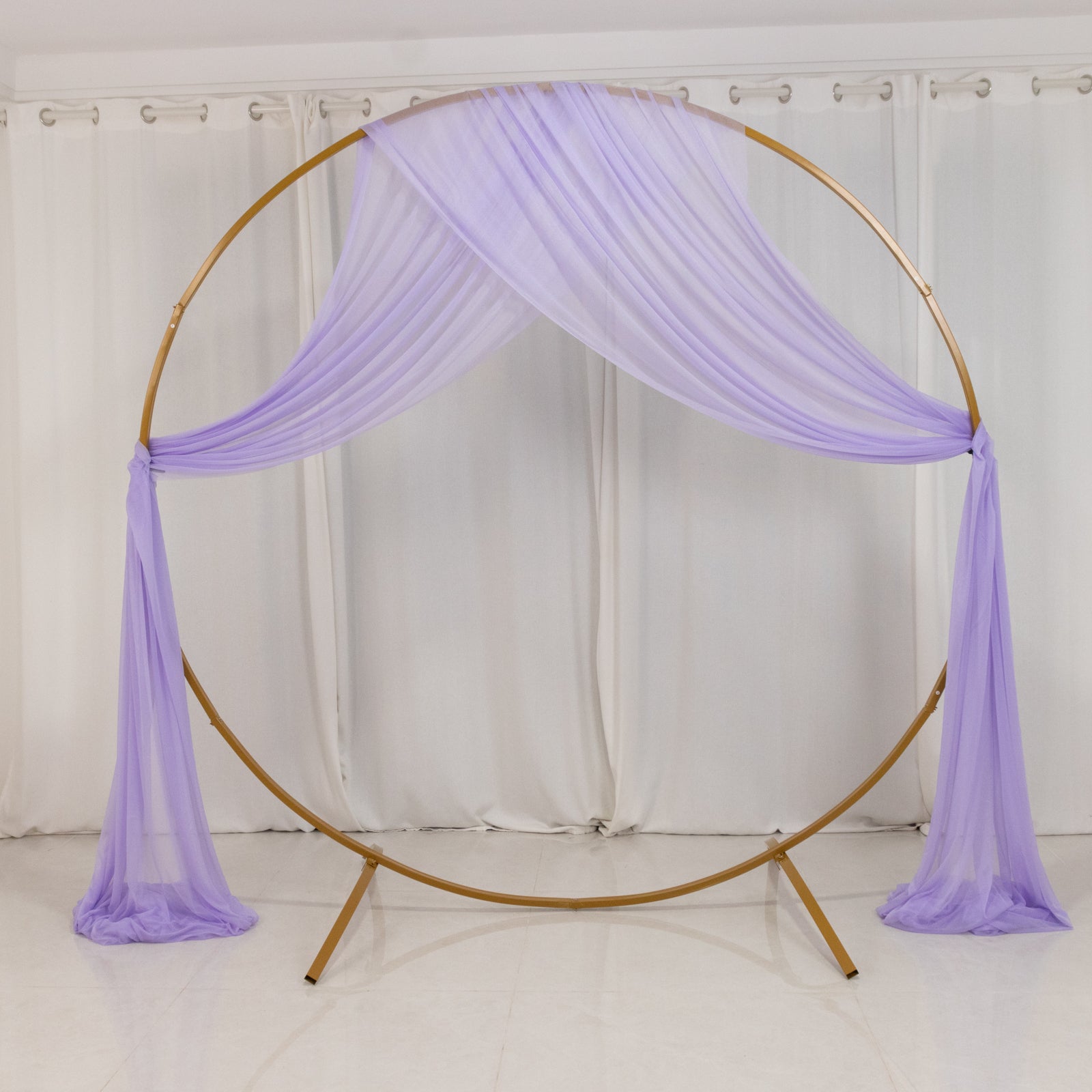 Lavender sheer backdrop drape for wedding arch decor.