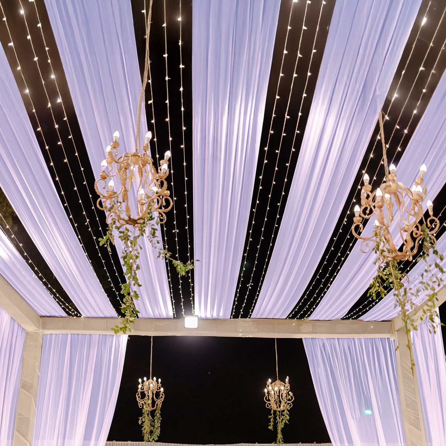 Lavender sheer backdrop drape with soft shimmer for wedding decor.