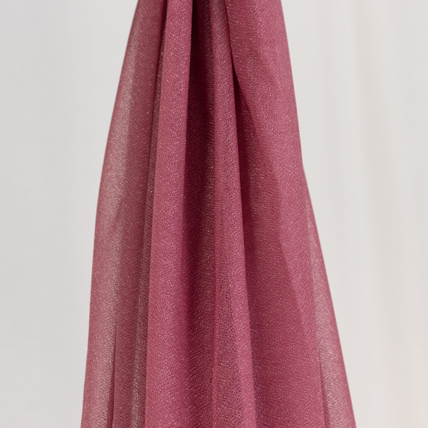 Mauve sheer backdrop drape with soft shimmer for wedding decor.