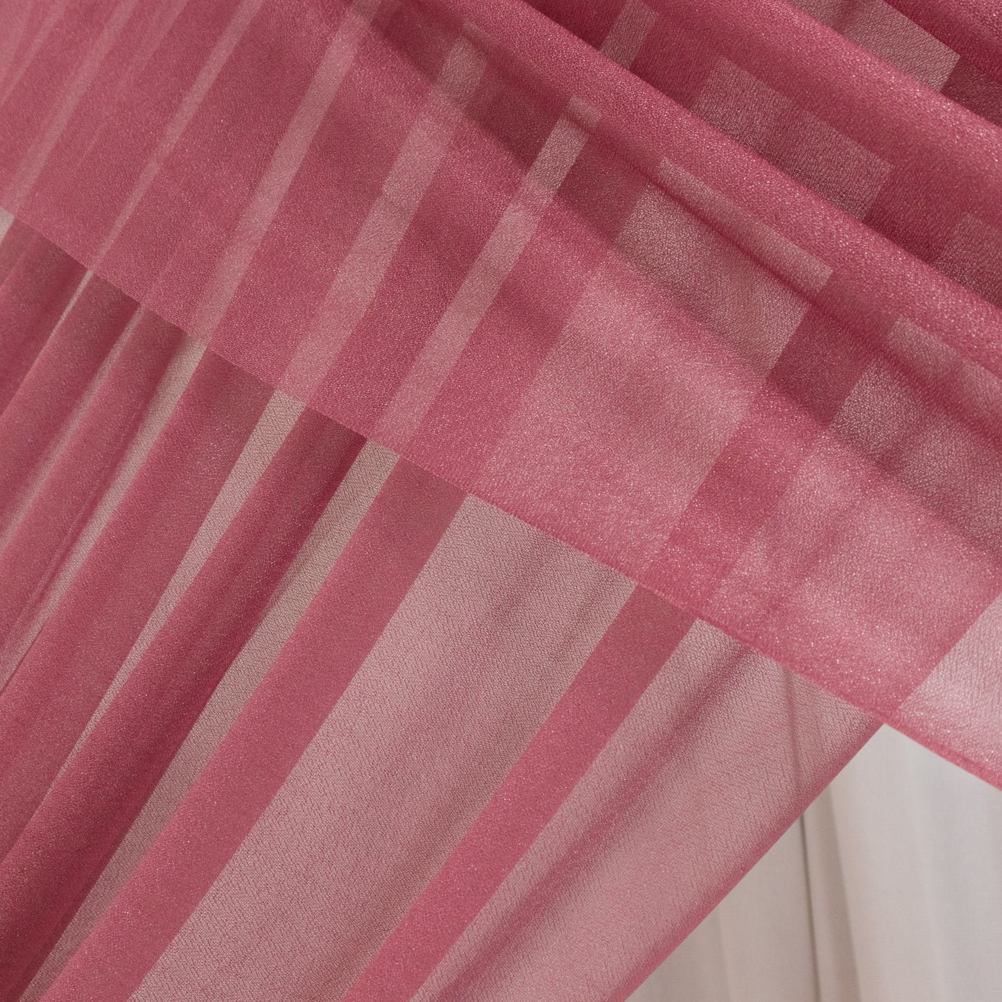 Mauve sheer backdrop drape for wedding arch and ceiling decor.