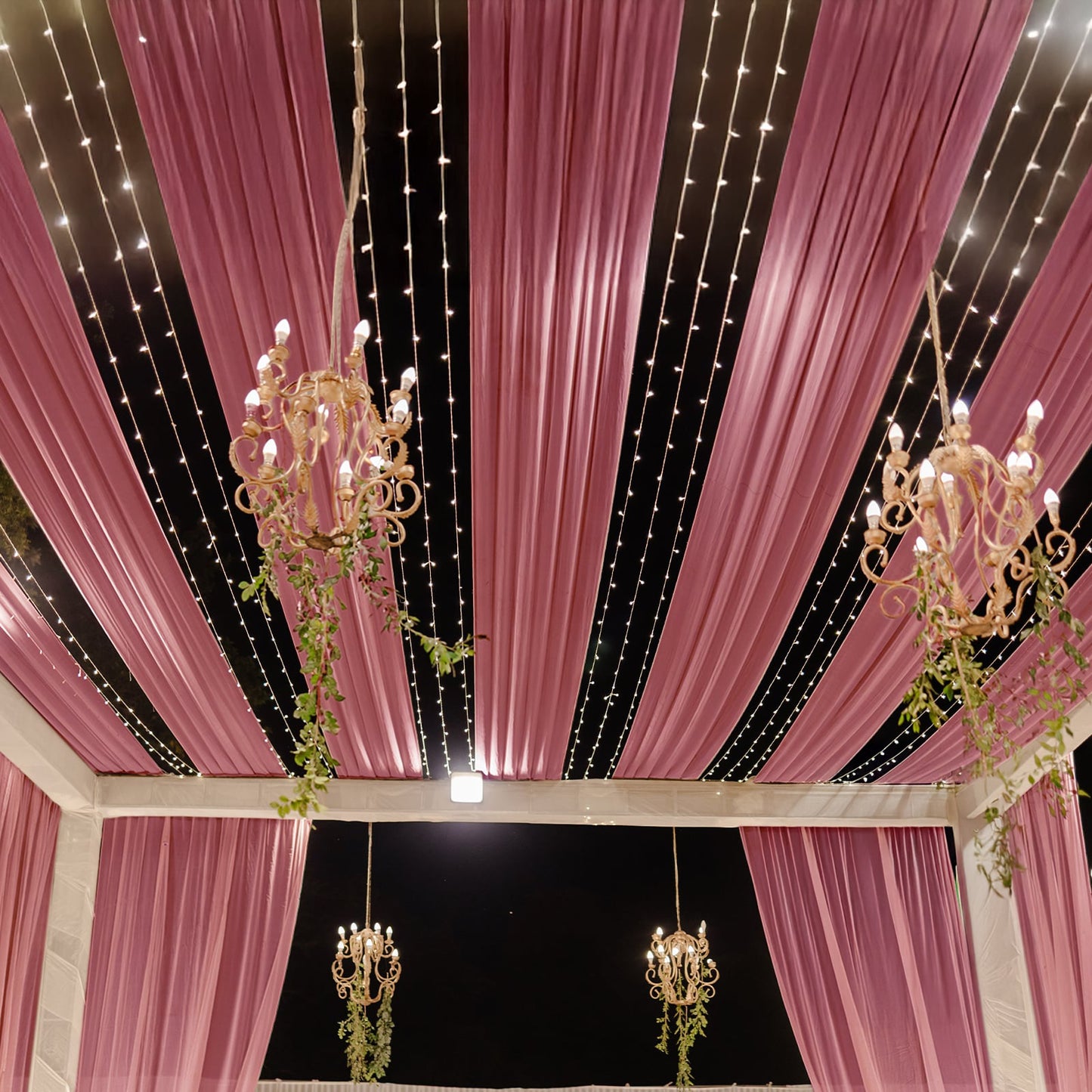 Mauve sheer backdrop drape with soft shimmer, perfect for wedding decor.