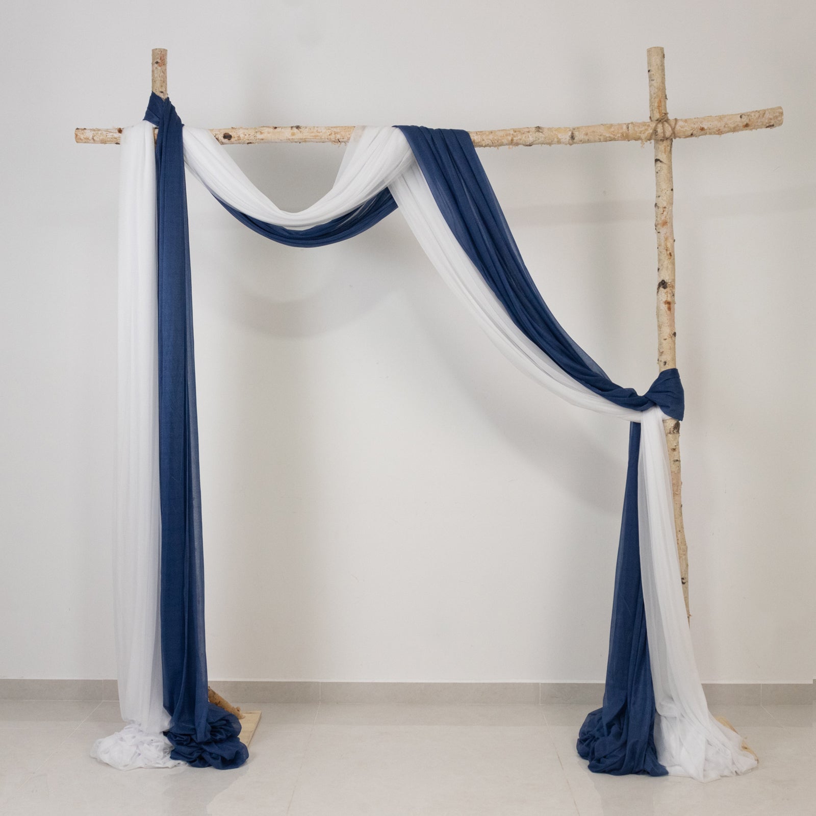 Navy blue sheer backdrop drape for wedding arch and ceiling decor.