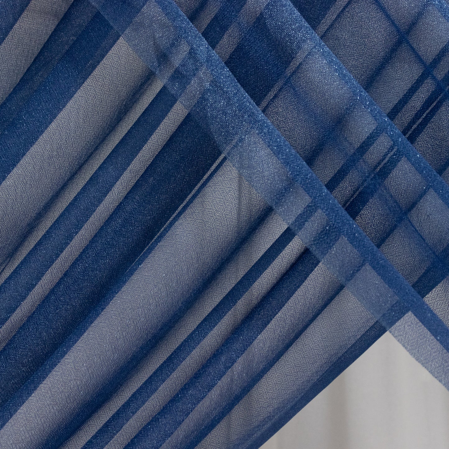 Navy blue sheer backdrop drape for wedding arch and ceiling decor.