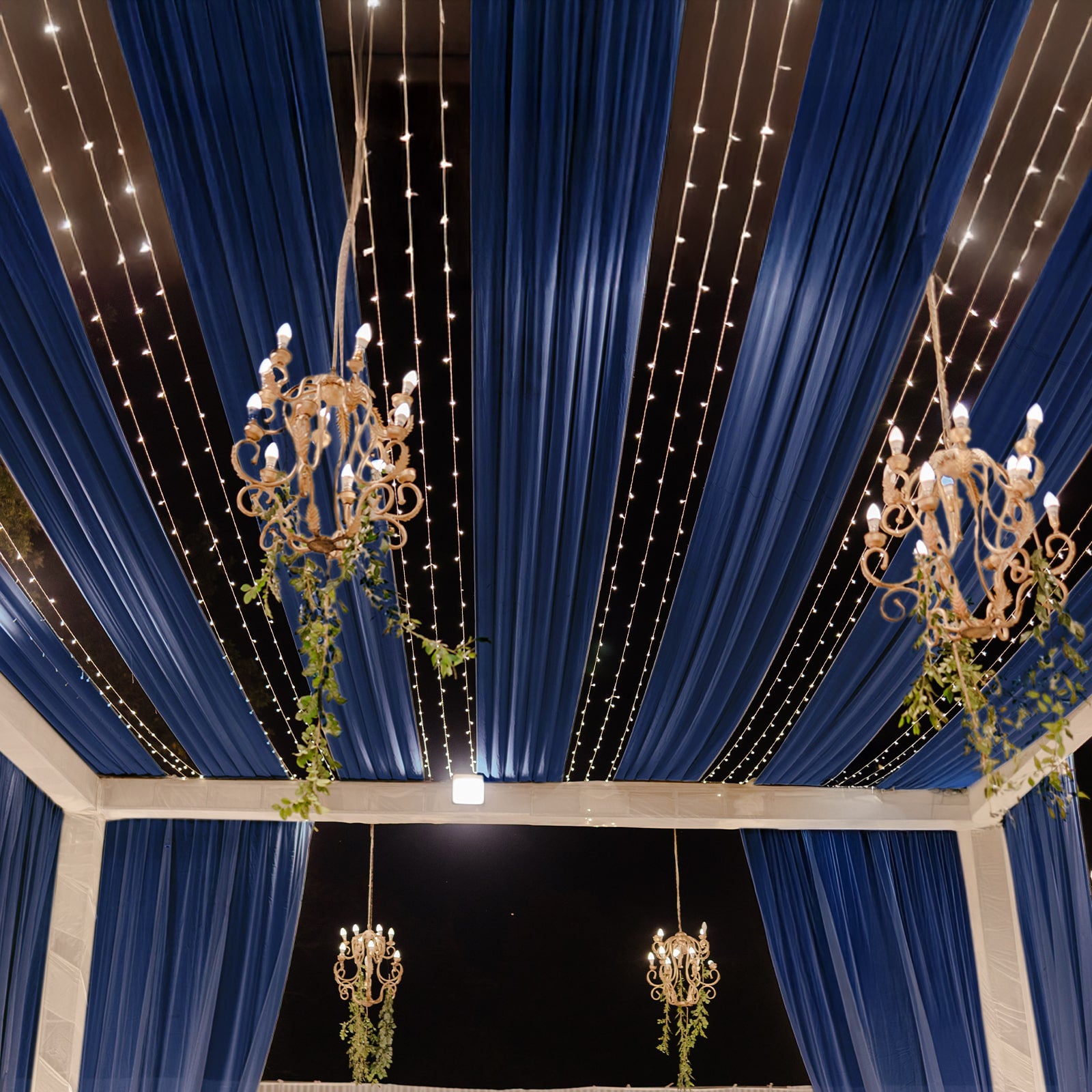Navy blue sheer backdrop drape for wedding arch and ceiling decor.