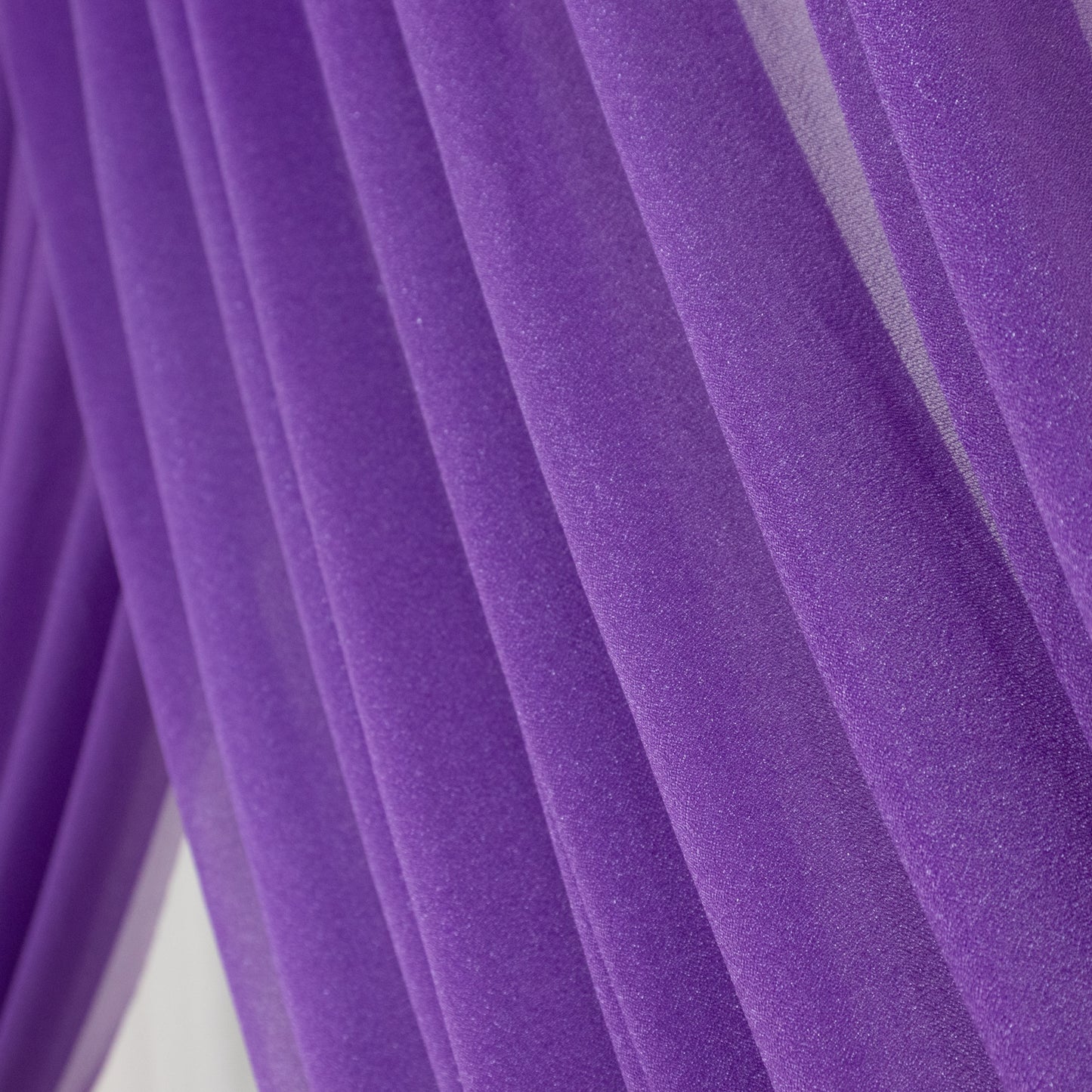 Purple sheer backdrop drape for wedding arch and ceiling decor.