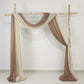 Taupe sheer backdrop drape for wedding arch and ceiling decor.