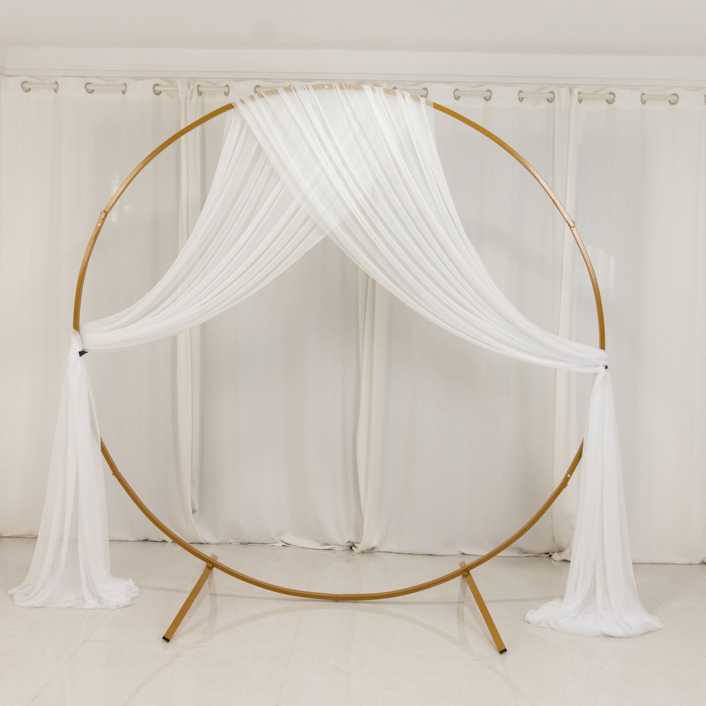 White sheer backdrop drape for wedding arch and ceiling decor.