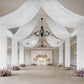White sheer backdrop drape for wedding arch and ceiling decor.