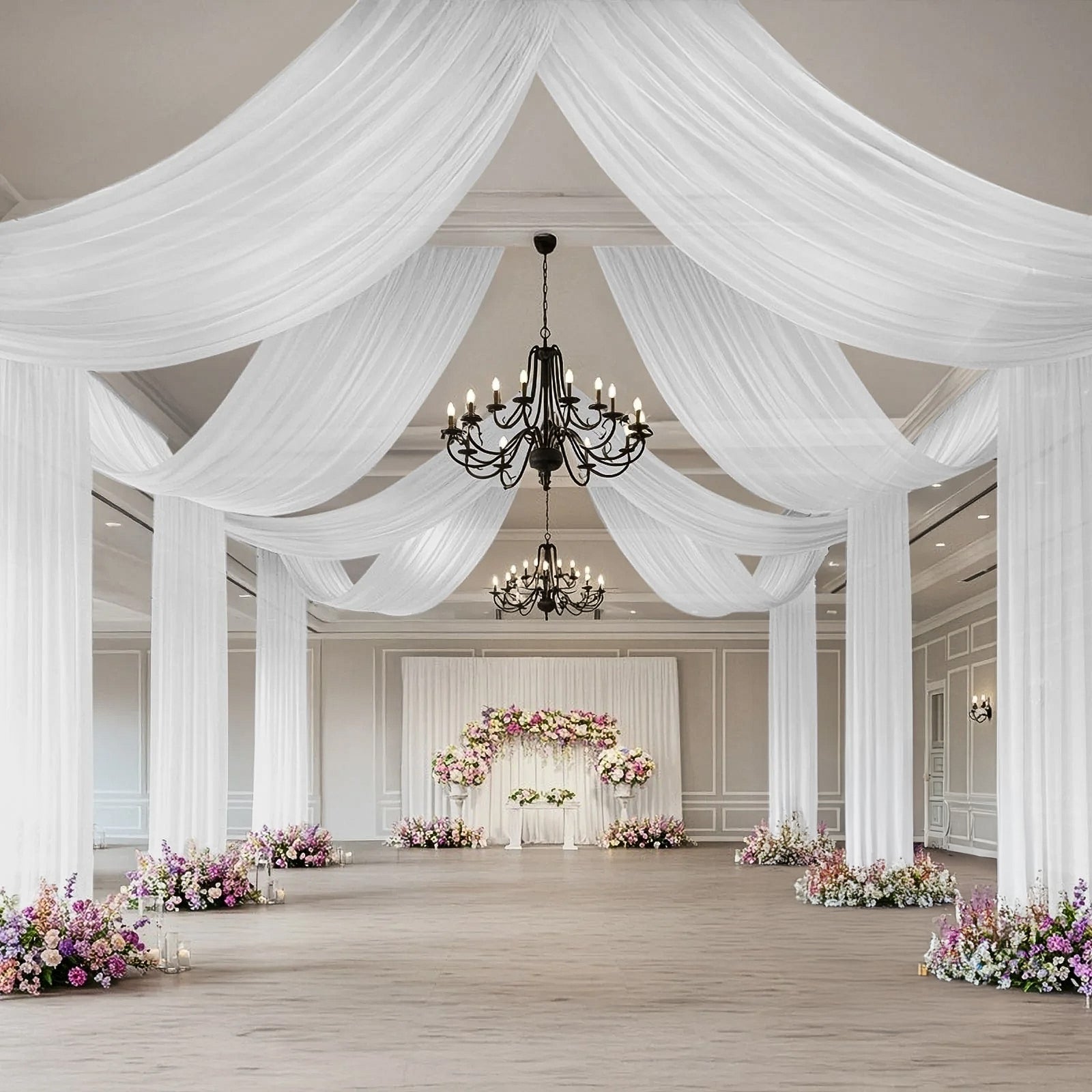 White sheer backdrop drape for wedding arch and ceiling decor.