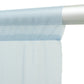 Dusty blue sheer backdrop curtain panel draped on a rod.