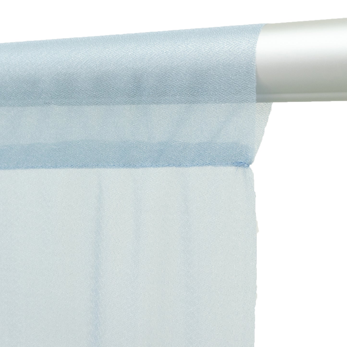 Dusty blue sheer backdrop curtain panel draped on a rod.