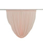 Blush chiffon backdrop valance drapes in a curved swag design.