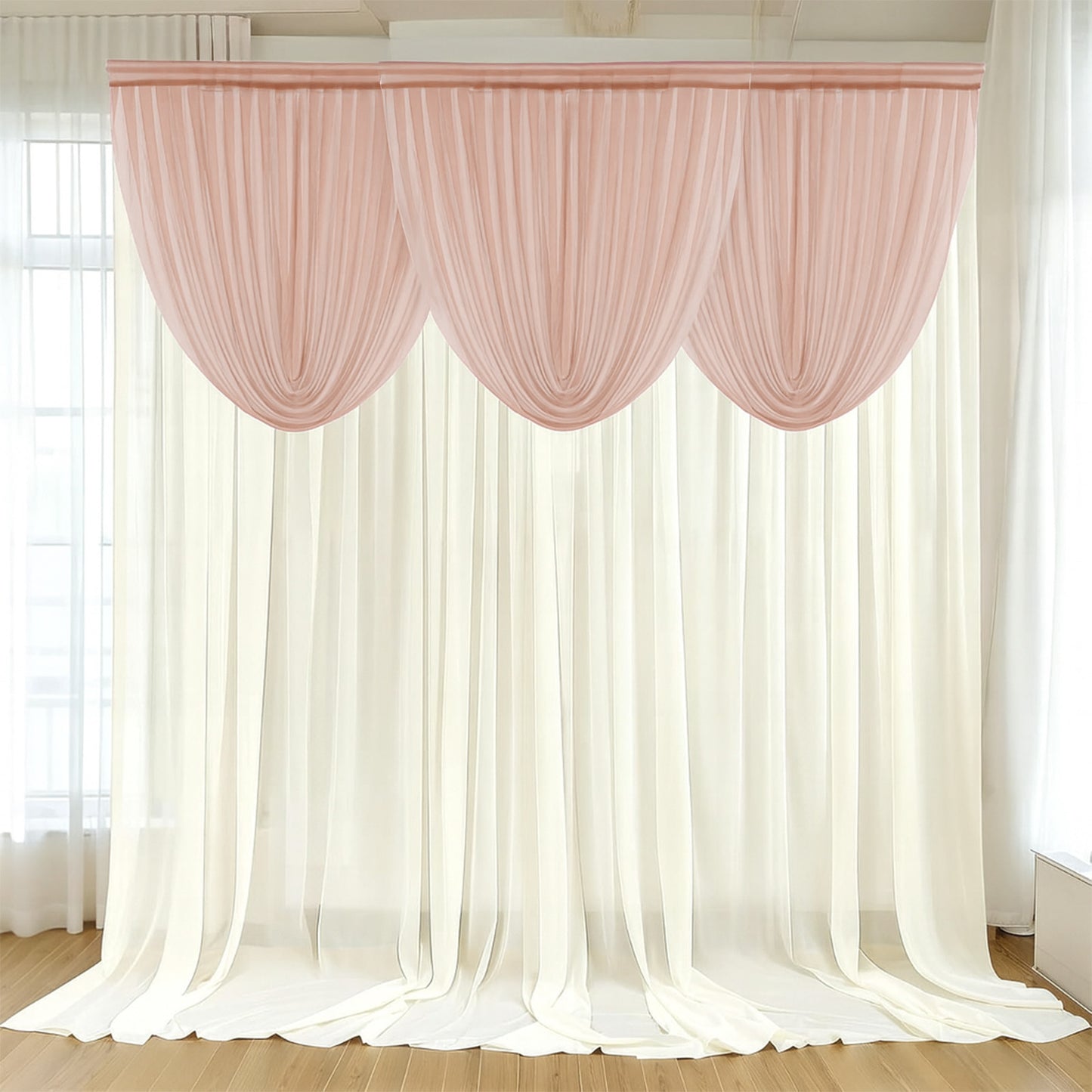 Blush sheer chiffon backdrop valance drapes with curved swag design.