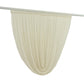 Beige sheer chiffon backdrop valance drapes with a curved swag design.