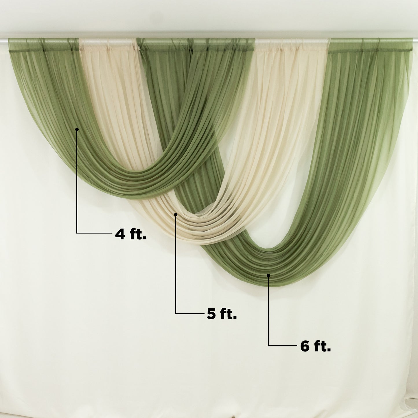 Dusty sage green chiffon backdrop drapes with curved swag design.