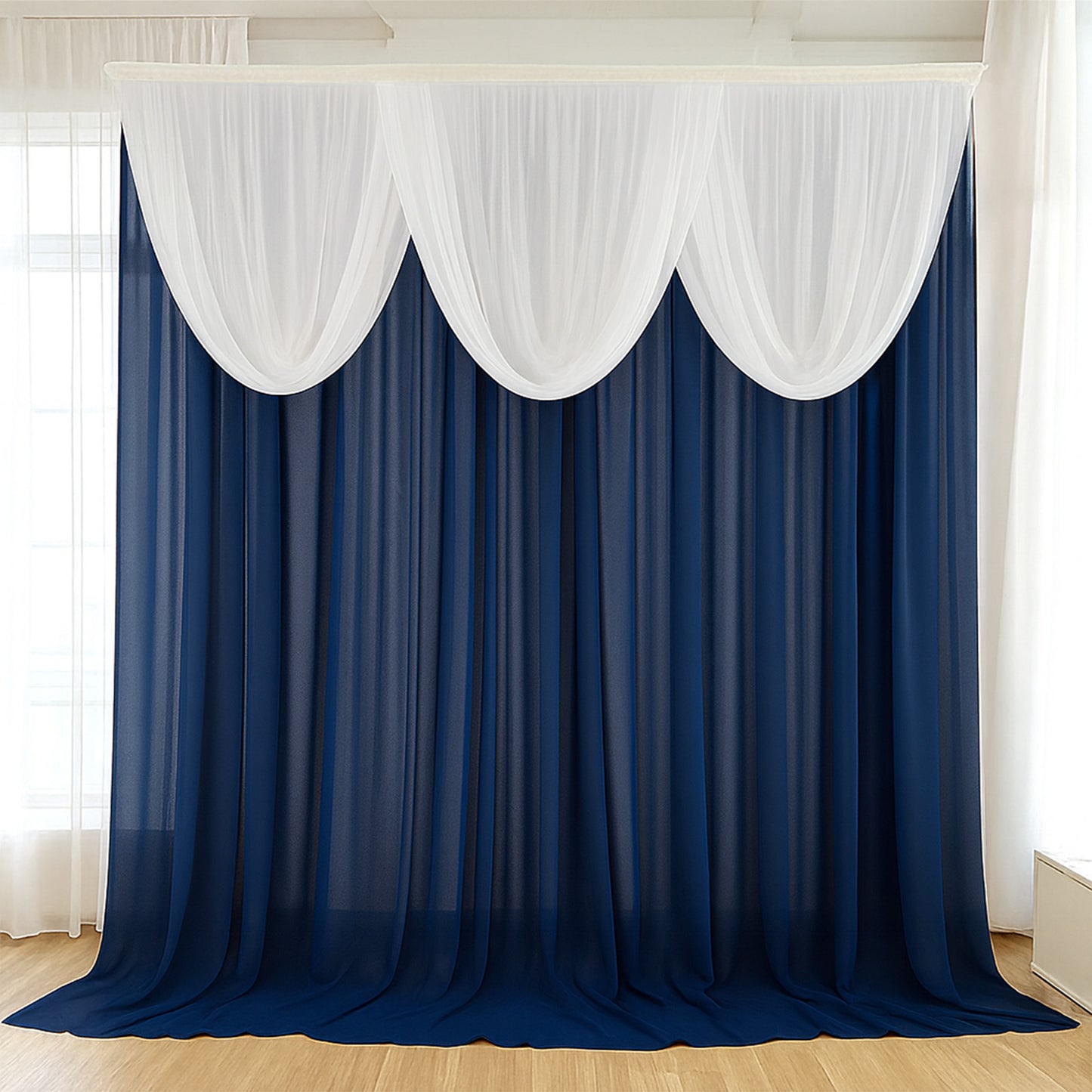 Navy blue sheer chiffon backdrop valance drapes with white curved swag topper.