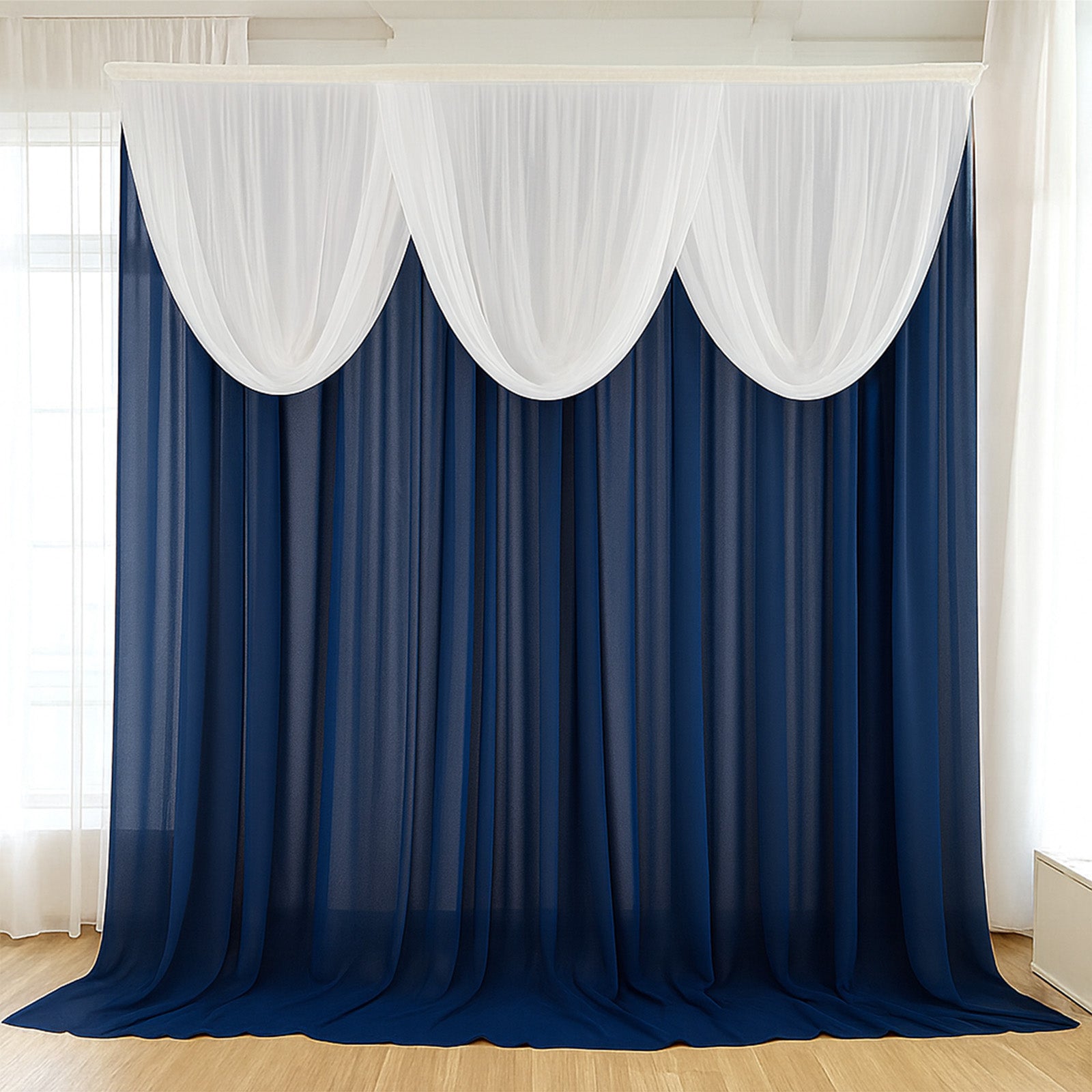 Navy blue sheer chiffon backdrop valance drapes with white curved swag topper.