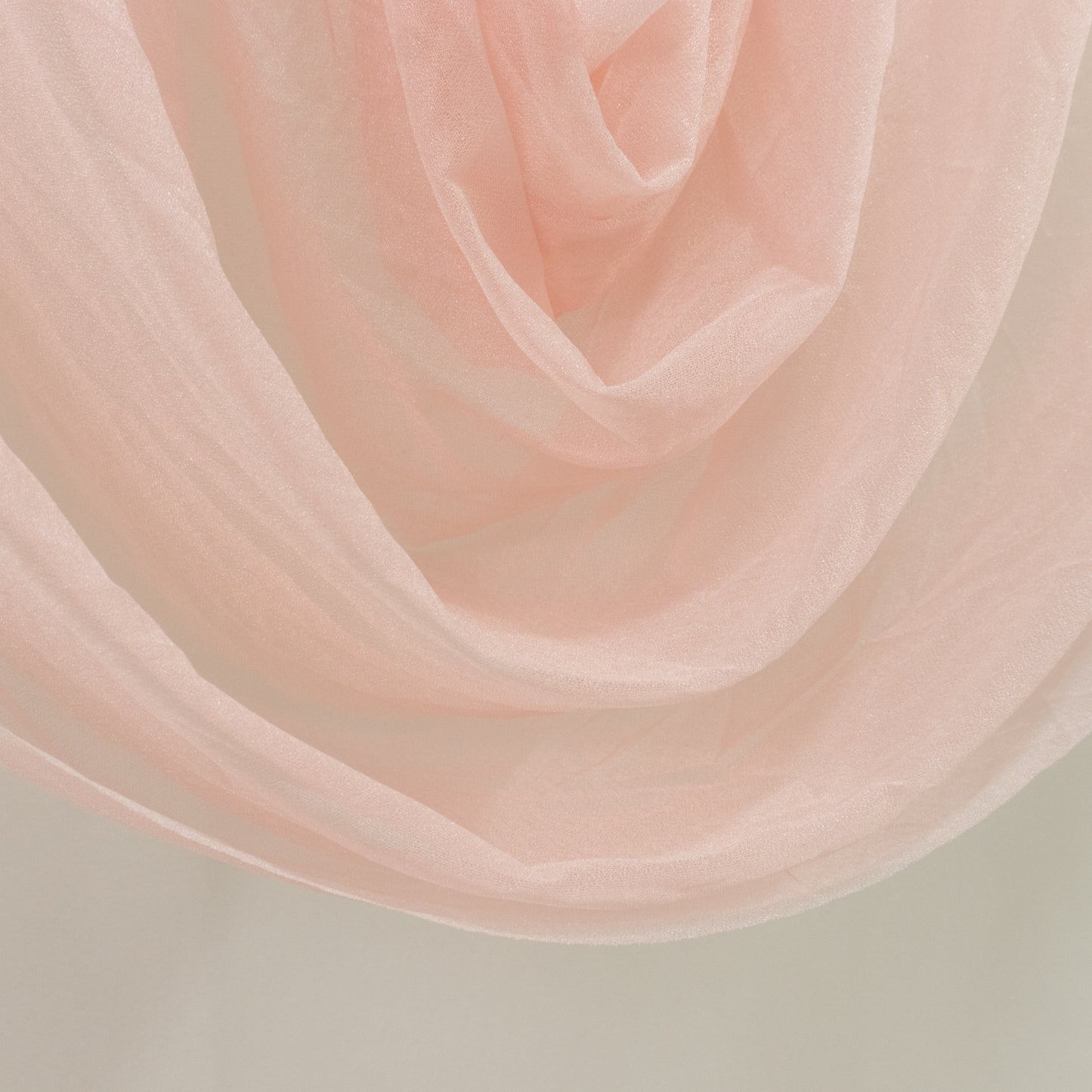 Blush sheer chiffon valance curtain draped elegantly.