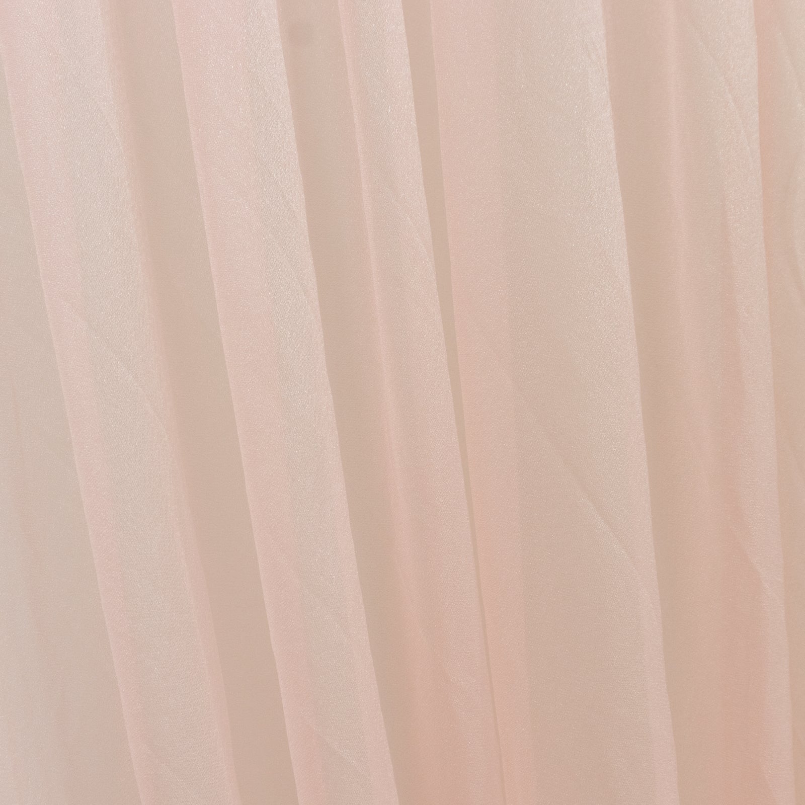 Blush sheer chiffon curtain drape for wedding arch and decor.
