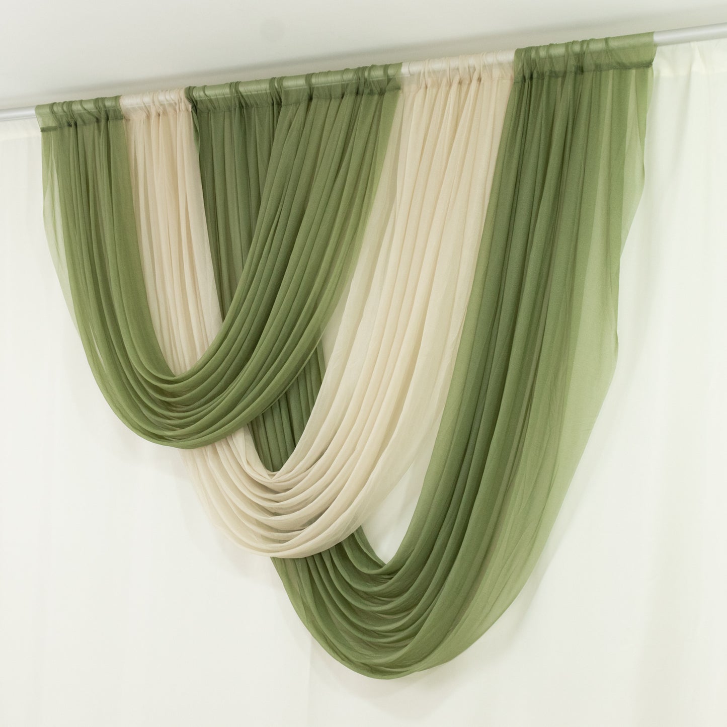 Beige sheer chiffon valance curtain draped elegantly in soft green.