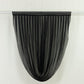 Black sheer chiffon valance curtain draped elegantly on a rod.