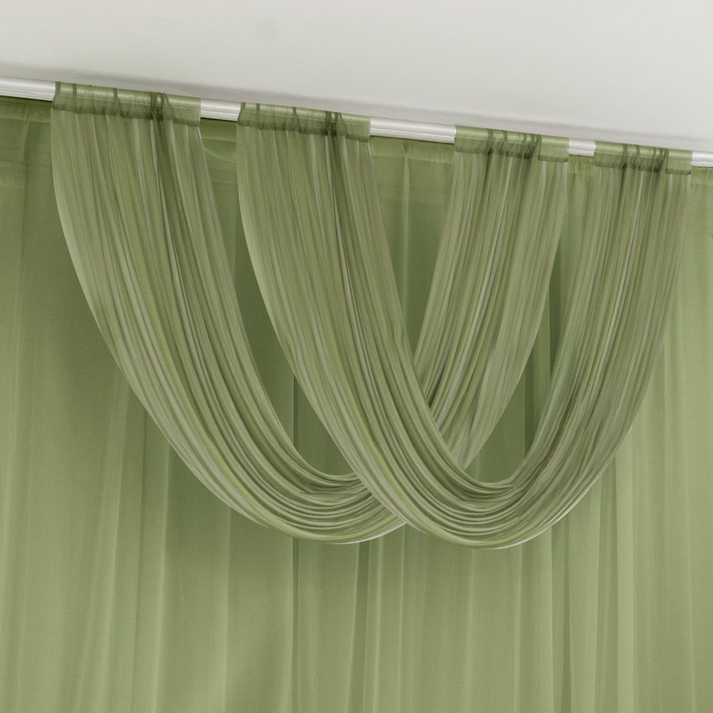 Dusty sage green sheer chiffon valance curtain draped elegantly.