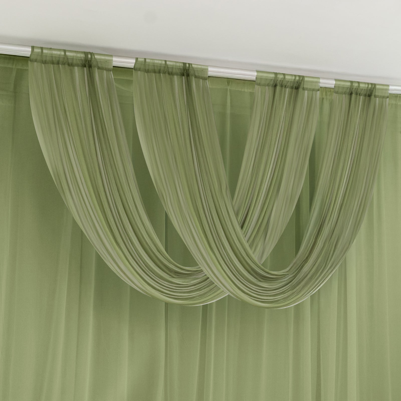 Dusty sage green sheer chiffon valance curtain draped elegantly.