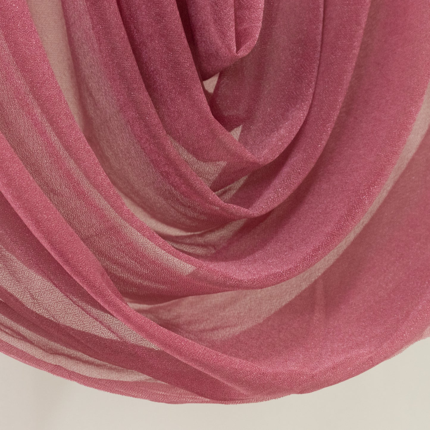 Mauve sheer chiffon valance curtain draped elegantly.
