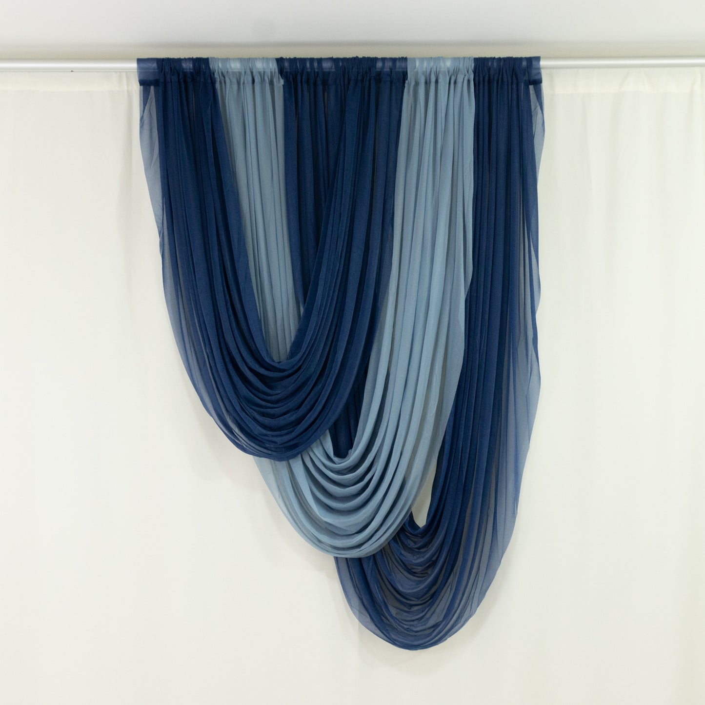 Navy blue sheer chiffon valance curtain draped elegantly.