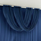 Navy blue sheer chiffon valance curtain draped elegantly on a rod.