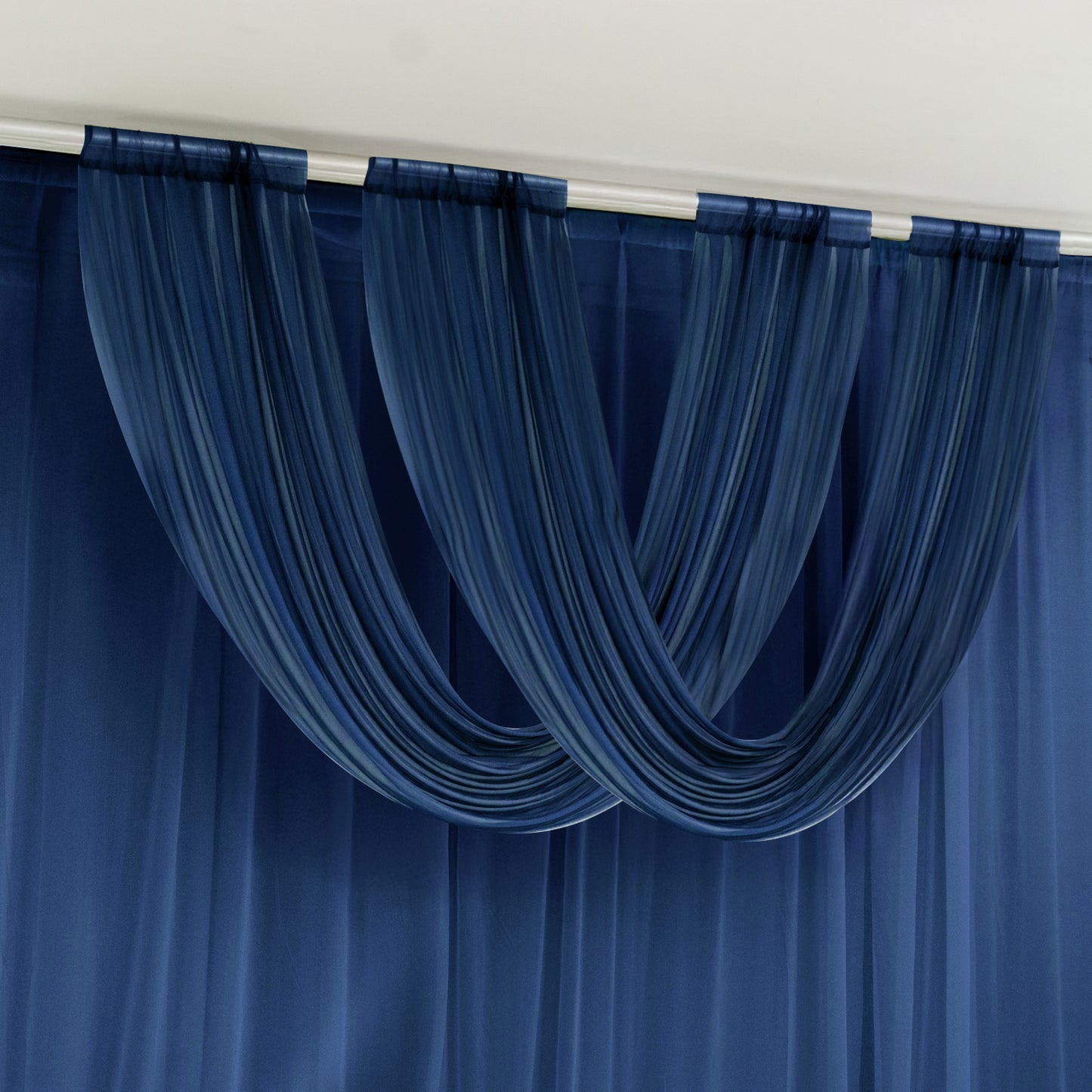 Navy blue sheer chiffon valance curtain draped elegantly on a rod.