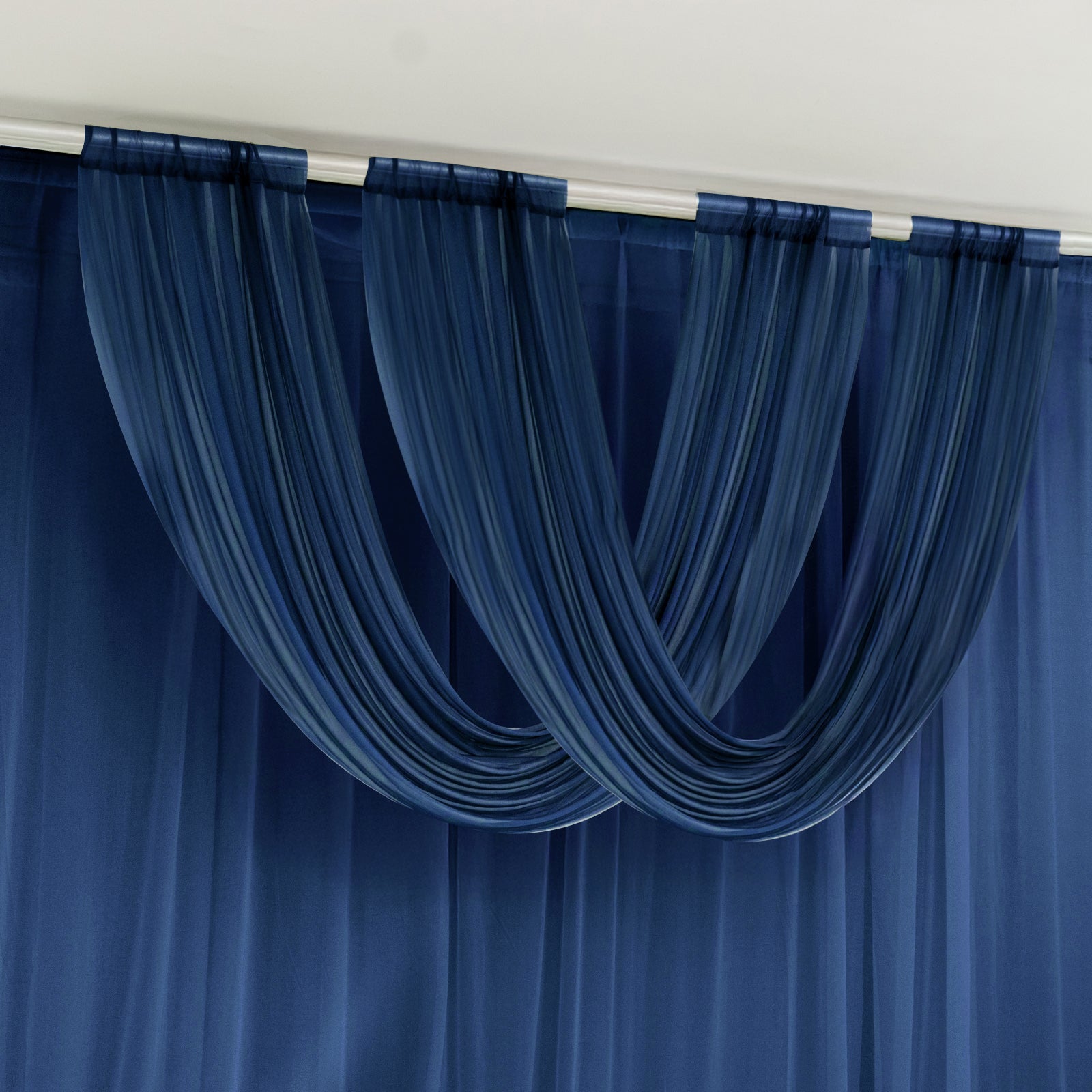 Navy blue sheer chiffon valance curtain draped elegantly on a rod.