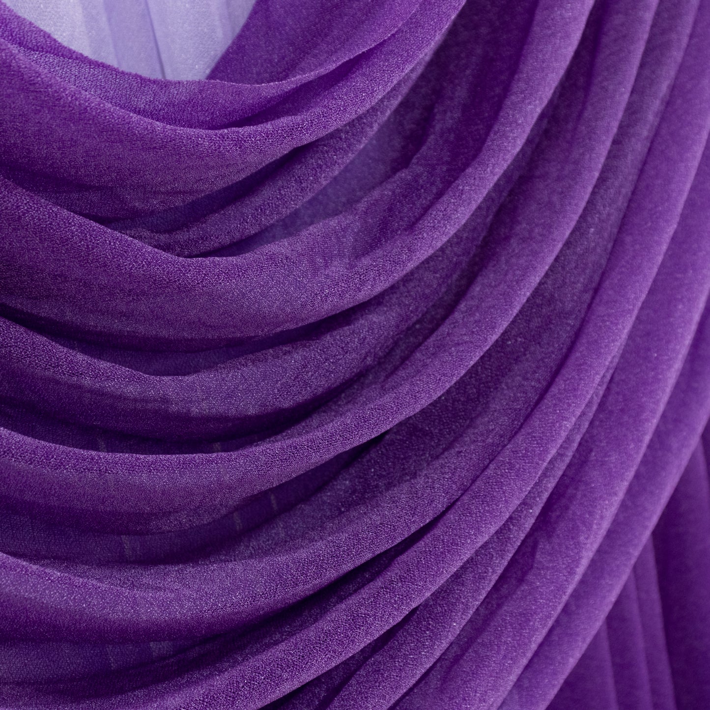 Purple sheer chiffon valance curtain draped elegantly.