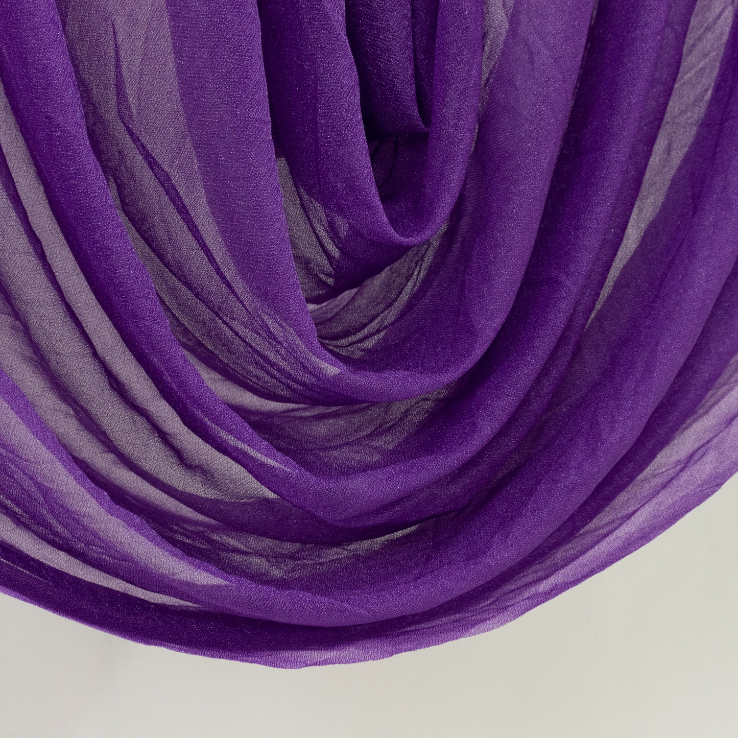 Purple sheer chiffon valance curtain draped elegantly.