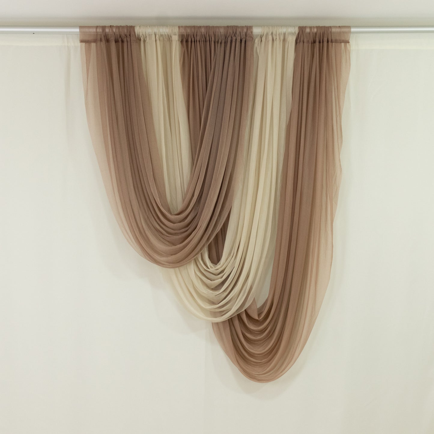 Taupe sheer chiffon valance curtain draped elegantly.