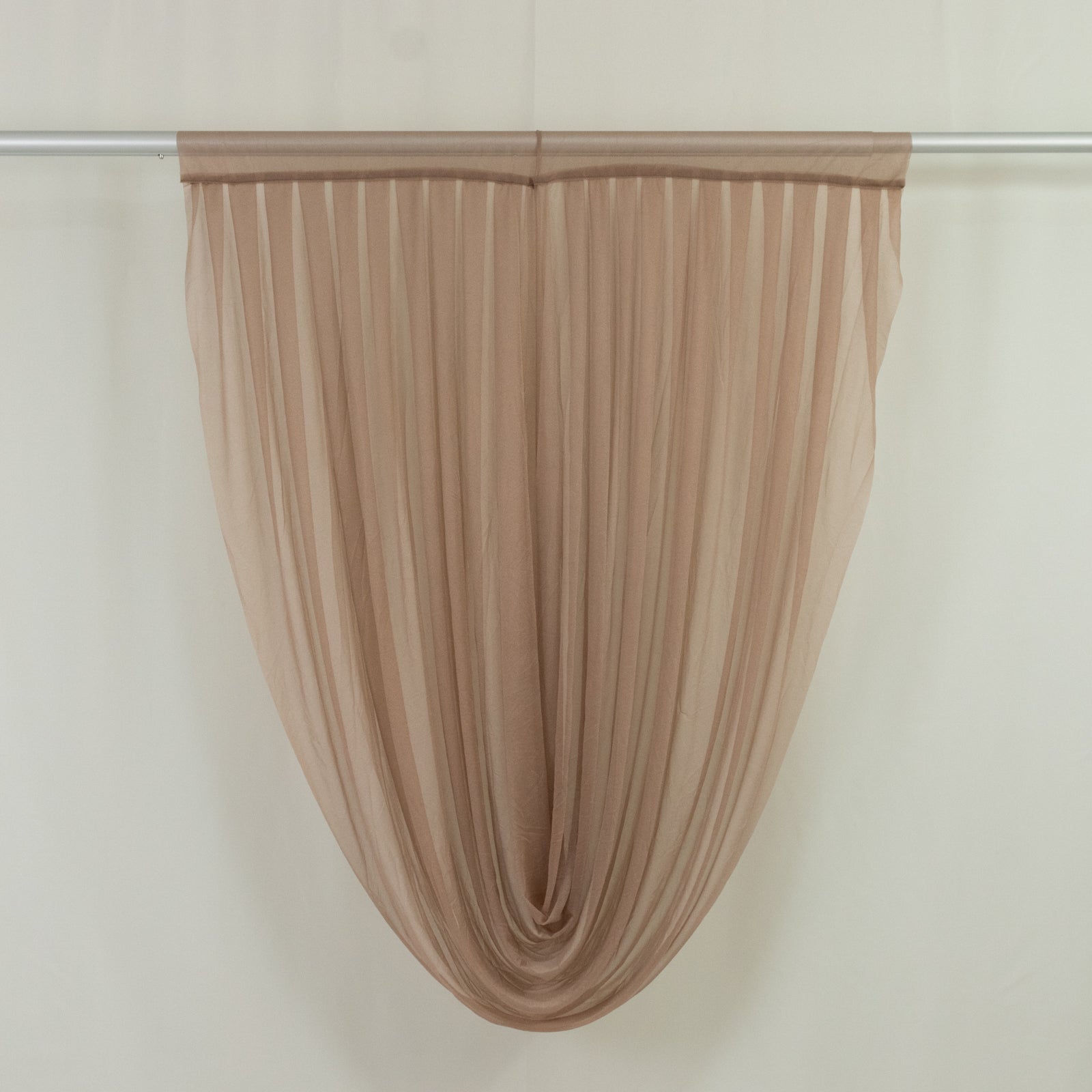 Taupe sheer chiffon valance curtain draped elegantly on a rod.