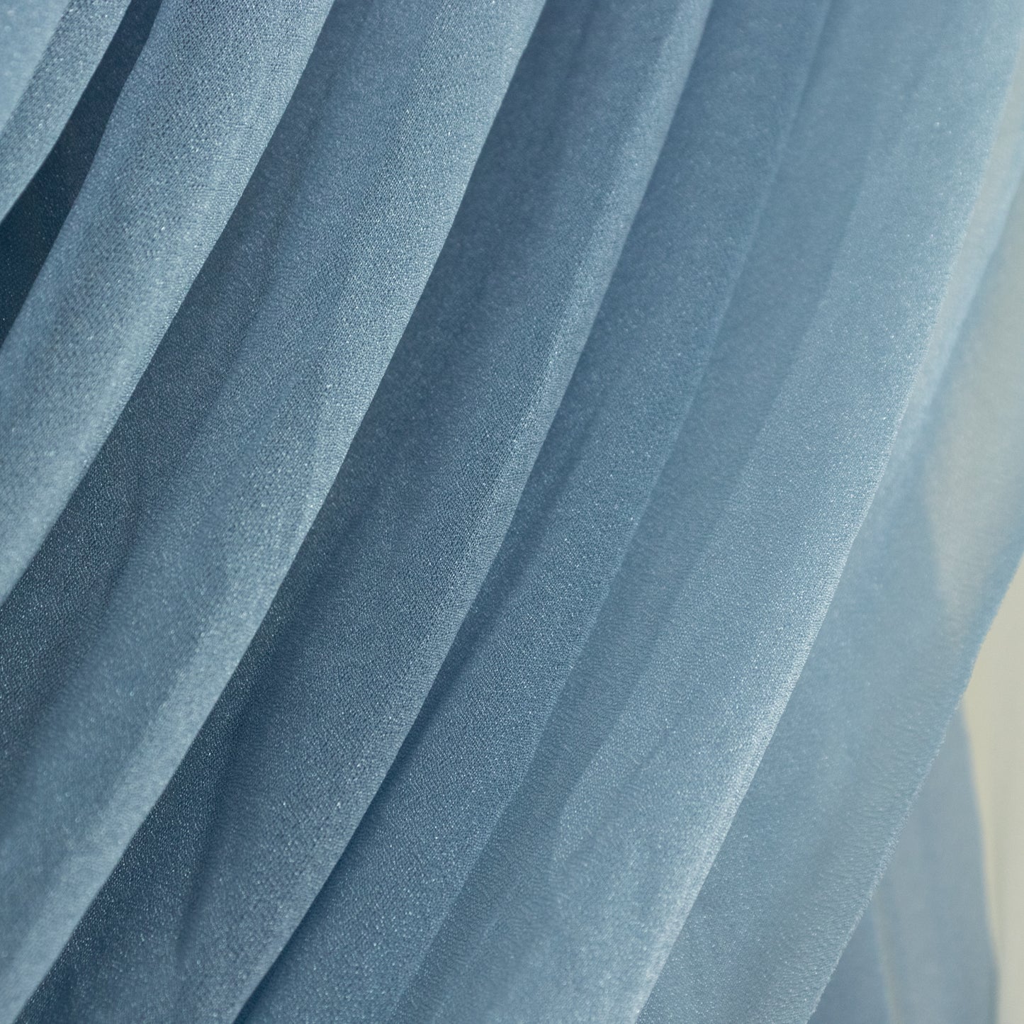 Dusty Blue sheer fabric draping elegantly in soft