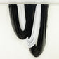 Black and white sheer drapery fabric for elegant home decor.