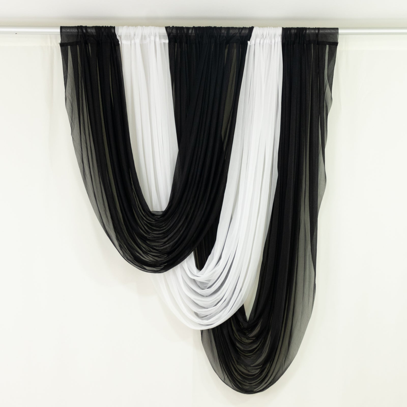 Black and white sheer drapery fabric for elegant home decor.