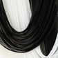 Black sheer fabric draped elegantly with white accents