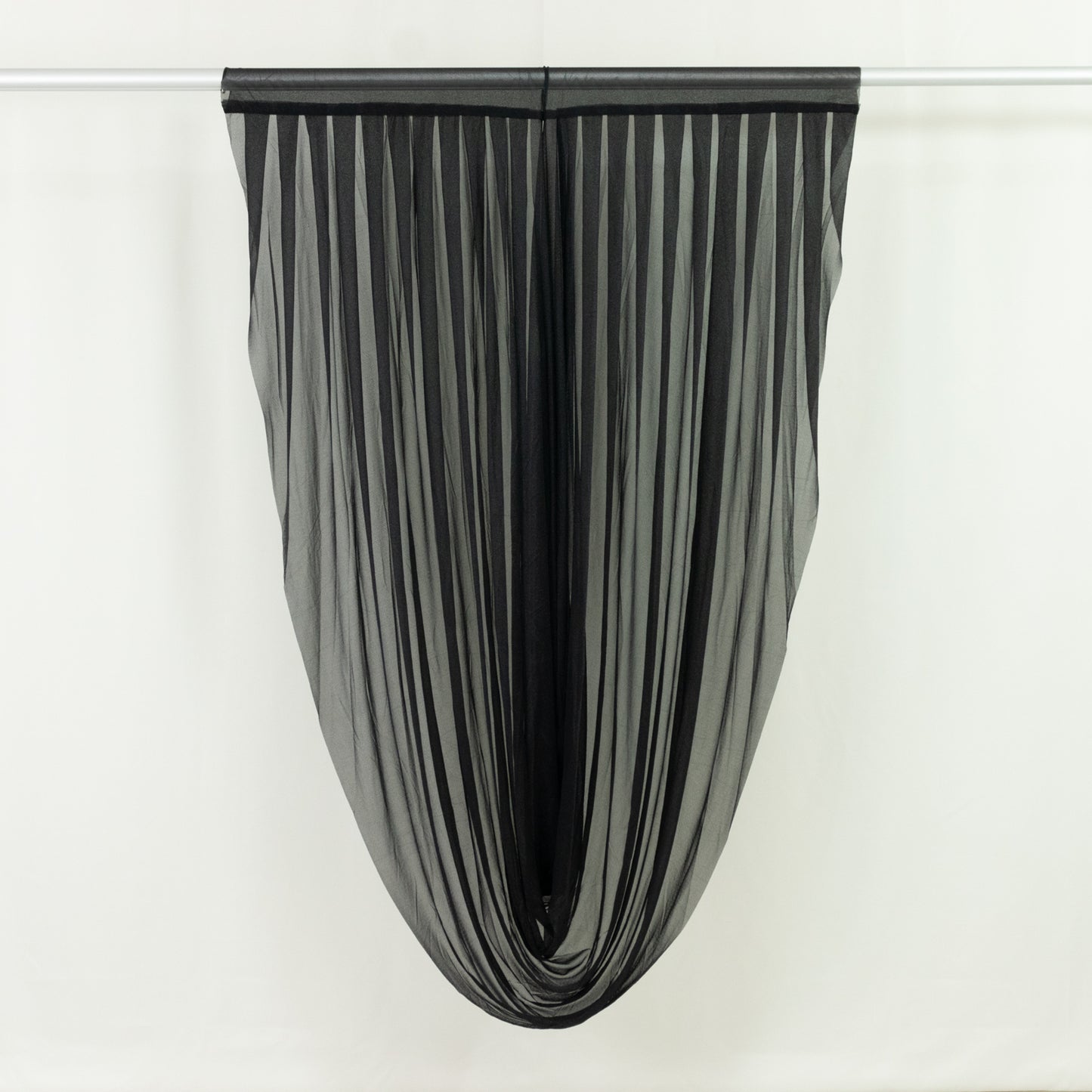 Black pleated curtain hanging elegantly