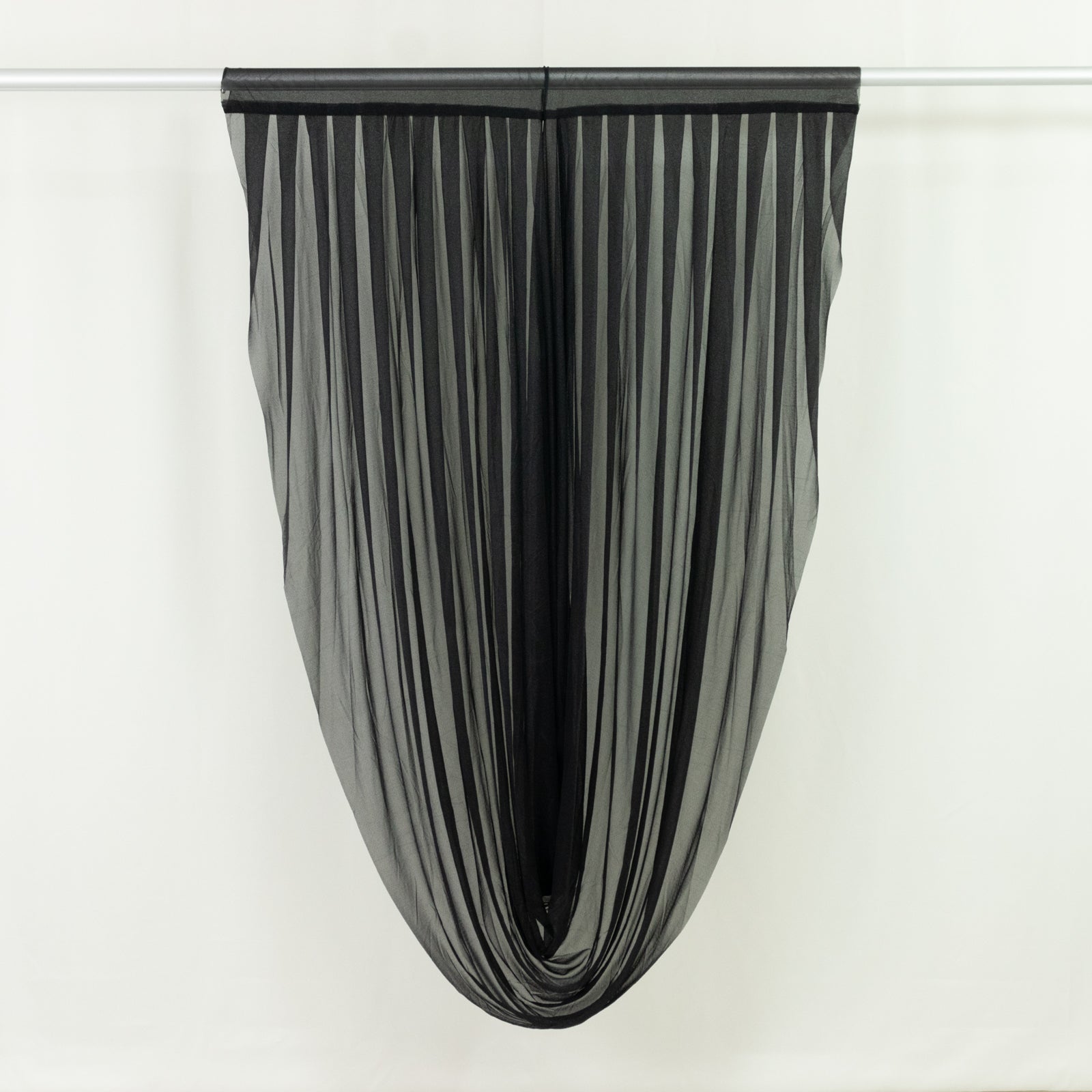 Black pleated curtain hanging elegantly