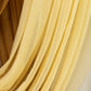 Champagne sheer chiffon valance curtain drape in elegant flowing fabric.