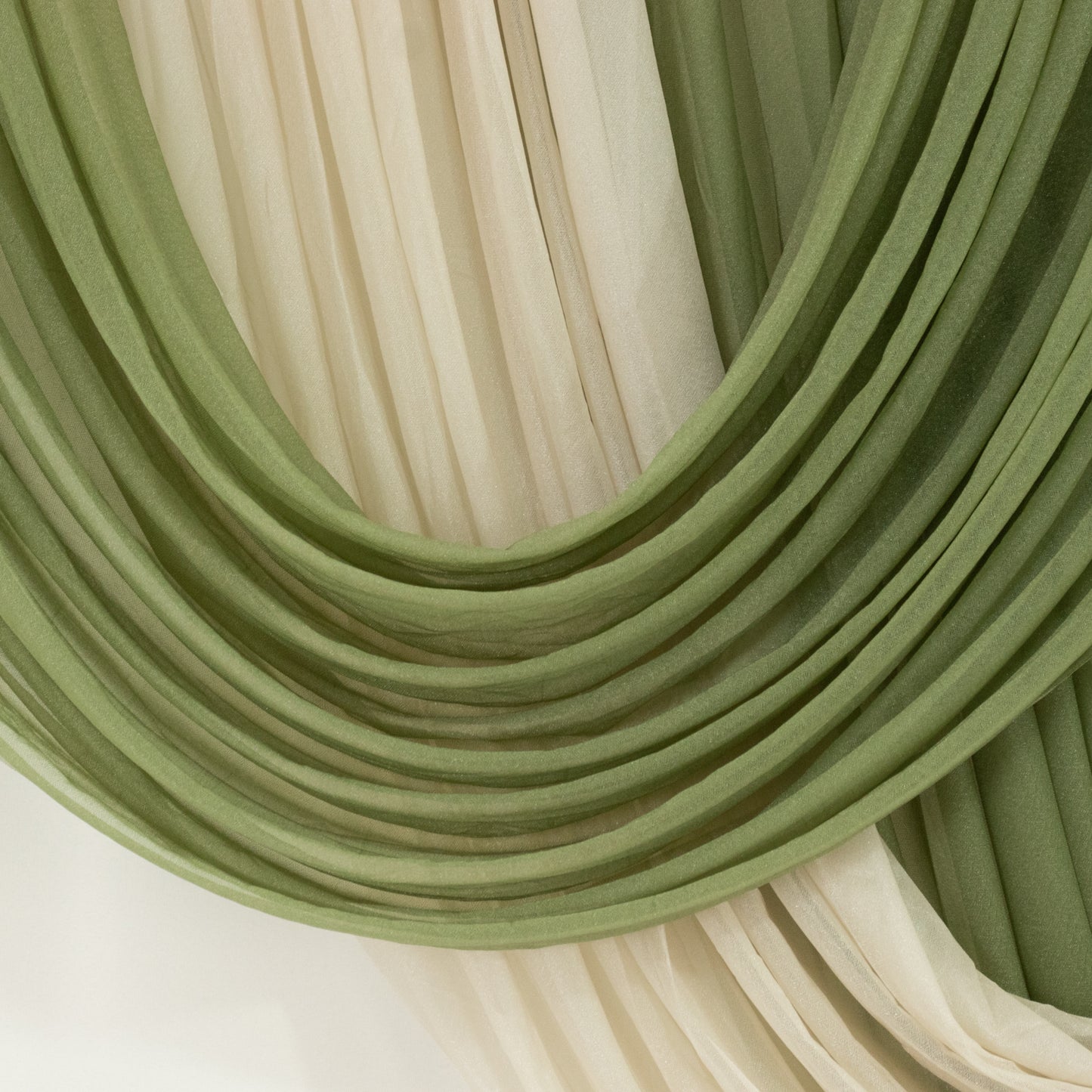 Dusty sage green sheer chiffon valance curtain draped elegantly.