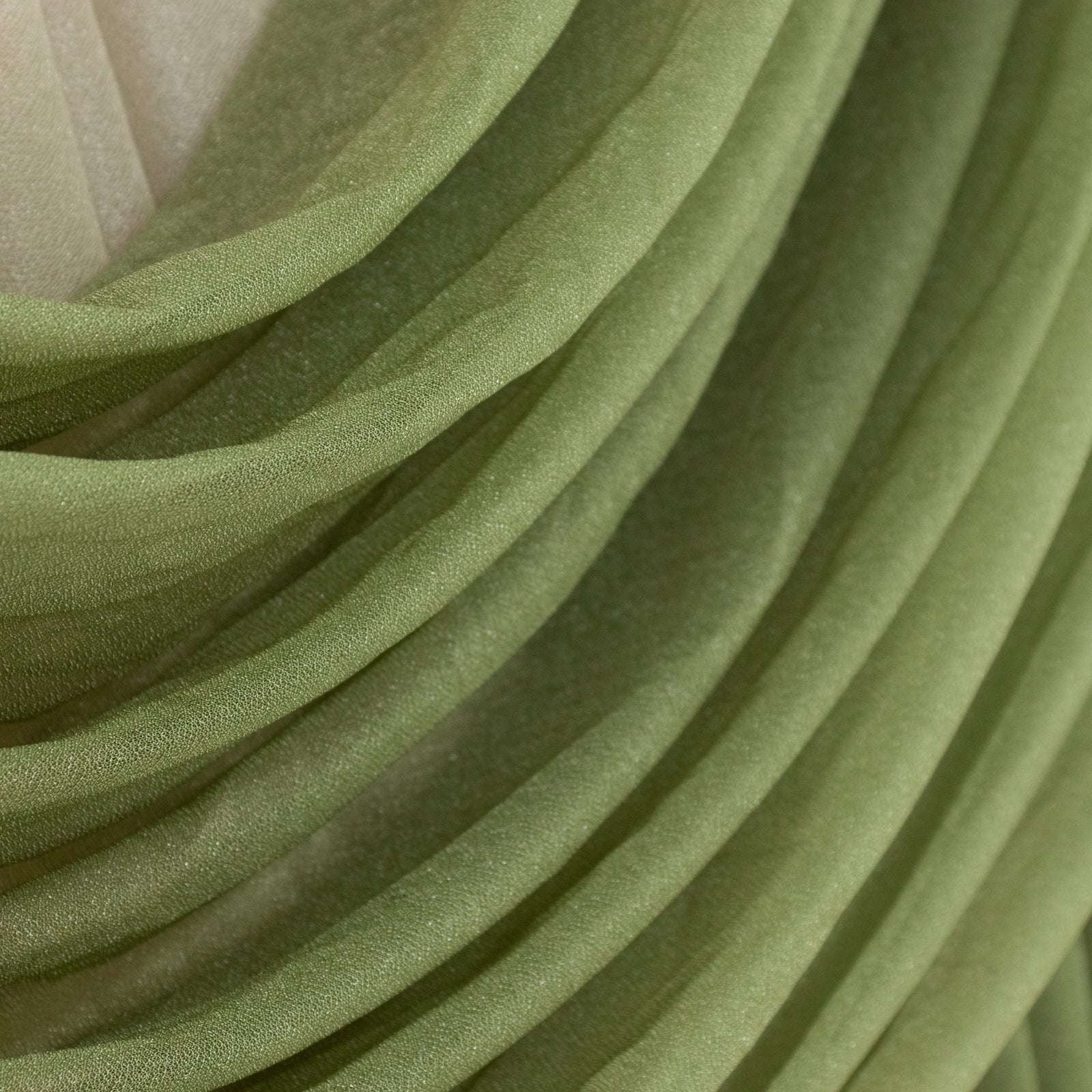 Dusty sage green sheer chiffon valance curtain draped elegantly.