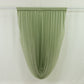 Dusty sage green sheer chiffon valance curtain draped elegantly.