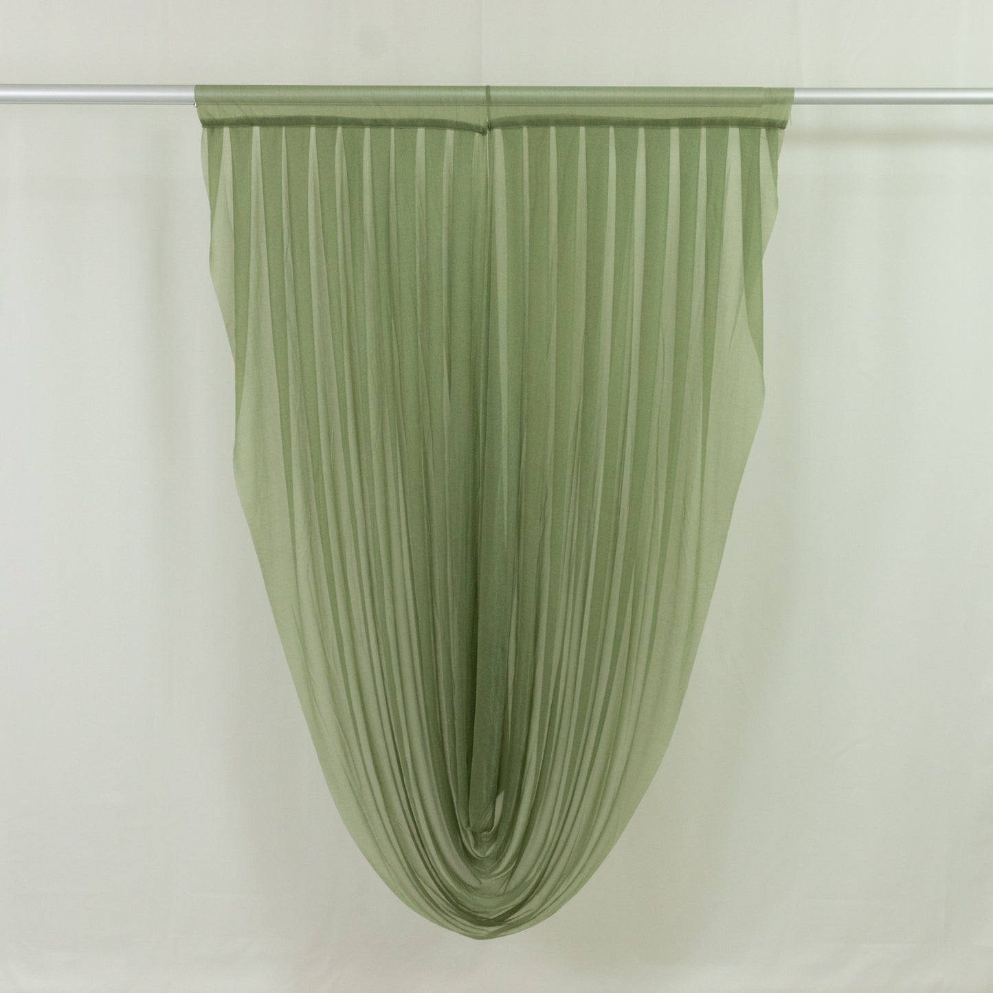Dusty sage green sheer chiffon valance curtain draped elegantly.